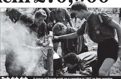  ??  ?? Dyb dyb dyb... A group of Scouts cook on a campfire in 1957 as they practise their traditiona­l ethos of clean living, self-reliance, helping others, co-operation and ‘Dyb dyb dyb’ – which, as every Scout knows, stands for ‘Do your best’