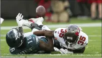  ?? MARK LOMOGLIO — THE ASSOCIATED PRESS ?? Tampa Bay Buccaneers cornerback Jamel Dean (35) breaks up a pass intended for Eagles wide receiver Quez Watkins (16) during Sunday’s game.