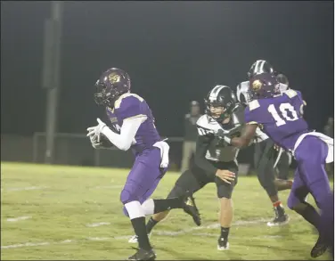  ?? Terrance Armstard/News-Times ?? Open field: Junction City's Kevontae Haynes (12) finds room to run with Dhante Gibson (10) throwing a block during the Dragons' 8-2A contest against Bearden last month in Junction City. On Friday, Junction City hosts McCrory in the opening round of the 2A playoffs. Game time is set for 7 p.m.