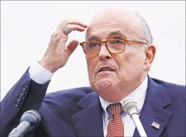  ?? Charles Krupa / Associated Press ?? In a 2018 photo, Rudy Giuliani addresses a gathering at a Donald Trump campaign event in Portsmouth, N.H.