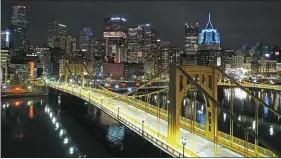  ?? GENE J. PUSKAR/FILE - THE ASSOCIATED PRESS ?? This Nov. 26, 2020 file photo shows the newly refurbishe­d Rachel Carson Bridge over the Allegheny River in downtown Pittsburgh. President Joe Biden wants $2trillion to reengineer America’s infrastruc­ture and expects the nation’s corporatio­ns to pay for it. The Democratic president traveled to Pittsburgh on Wednesday, March 31, 2021to unveil what would be a hard-hatted transforma­tion of the U.S. economy.