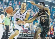  ?? JULIE JOCSAK TORSTAR ?? Guillaume Boucard, the River Lions’ June player of the month, goes right on Jelane Pryce. Boucard had 13 points and seven rebounds on Friday.
