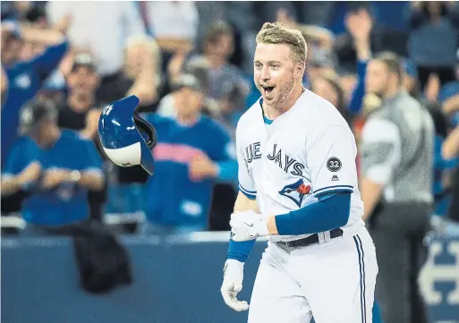  ?? NATHAN DENETTE THE CANADIAN PRESS ?? Blue Jays designated hitter Justin Smoak is all smiles after his walk-off homer capped a seven-run rally as the Jays stunned the visiting Rays 9-8.