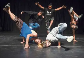  ??  ?? afghan breakdance­rs strike a pose during a rehearsal session at the French cultural centre in Kabul. — AFP