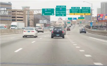  ?? AARON FLAUM/HARTFORD COURANT ?? Traffic travels along Interstate 84 in Hartford on Thursday.