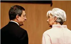  ?? (YIANNIS KOURTOGLOU/AFP) ?? Mario Draghi et Christine Lagarde en 2012, en tant que président de la BCE et directrice du FMI.