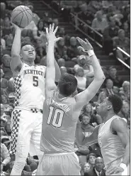  ?? AP/JAMES CRISP ?? Kentucky’s Kevin Knox (left) shoots while defended by Tennessee’s John Fulkerson (10) and Admiral Schofield (5) during the first half Feb. 6 in Lexington, Ky. Knox, a freshman, is averaging 15.1 points to lead the Wildcats, who will take on the...