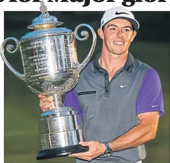  ?? ?? Rory McIlroy lifts the Wanamaker Trophy after winning at Valhalla in 2014.