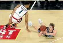  ?? GETTY IMAGES ?? Finn Delany of the Breakers dives for a loose ball against Adelaide’s Demetrius Conger during their clash in Auckland on Thursday night.