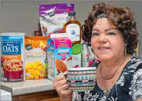  ?? PHOTO BY MELANIE STENGEL/SUBMITTED ?? Nydia Rodriguez, 64, with a smoothie she made for lunch. The Lawrence + Memorial Hospital program has helped her manage her diabetes and she’s lost 20 pounds.