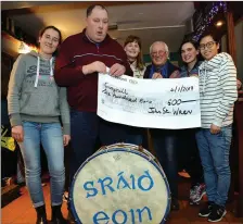  ??  ?? Carla Osterholz, Tomás Ferriter, Lotte Meier, Christoph Jensen, Adeline Fehey-Palma and Karen Lau of the Dingle Camphill Communiity with a cheque for 600 euro which was donated by the Sráid Eoin Wren at their ball night in the Barrack Height pub on Friday. Photo by Declan Malone