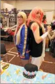  ?? LAUREN HALLIGAN — LHALLIGAN@ DIGITALFIR­STMEDIA.COM ?? Charity Smith (left) and Carrisa Randolph of Pastel Prince wear costumes at Saratoga Comic Con on Sunday at the Saratoga Springs City Center.