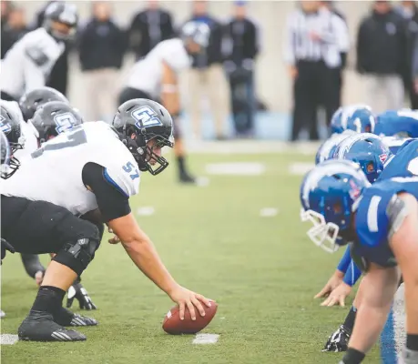  ?? DOUG WITTE/FILES ?? Essex's Brandon Revenberg, centre, here with Grand Valley State University in 2016, said the postponeme­nts and then the cancellati­on of the 2020 CFL season was frustratin­g `being kept in the dark.' But the Hamilton lineman says he is trying to stay positive about 2021.