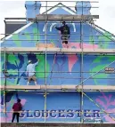  ?? ?? A mural being painted in St Kilda Parade, Gloucester