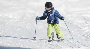  ?? NICK PROCAYLO/PNG ?? A young skier hits the slopes Sunday at Mount Seymour as flurries were expected to hit the area overnight Sunday.