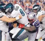  ?? MARY SCHWALM/ASSOCIATED PRESS ?? Eagles QB Nick Foles (9) is sacked by Adam Butler during their game Thursday night. Foles was sacked three times in the game and left with a sprained shoulder.