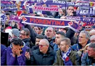  ?? Reuters ?? People outside the church with Fiorentina scarves at Davide Astori’s funeral on Thursday. —