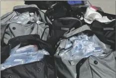  ?? PHOTO COURTESY CBP EL CENTRO SECTOR ?? Confiscate­d contraband, 692 pounds of methamphet­amine, sits in duffle bags after a bust of mother-daughter smugglers on Tuesday, February 21, in Indio.