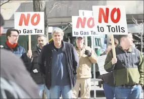  ?? Bob Luckey Jr. / Hearst Connecticu­t Media ?? Participan­ts take part in a protest against any tolls, a new gas tax and a tire tax earlier this year. The demonstrat­ion was held in front of the Stamford Goverment Center. Roughly 75 people attended the protest that was accompanie­d by a caravan of...