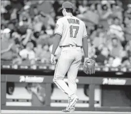  ?? Bob Levey Getty Images ?? THE ANGELS’ Shohei Ohtani exits the game in the third inning after throwing 49 pitches. “At this point, my elbow feels fine,” he said after the game.