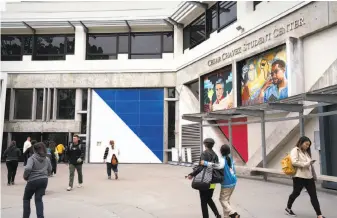  ?? Sarahbeth Maney / Special to The Chronicle ?? Students at San Francisco State University walk past the Cesar Chavez Student Center. With voters electing a new governor, questions loom over how California’s school system will evolve.