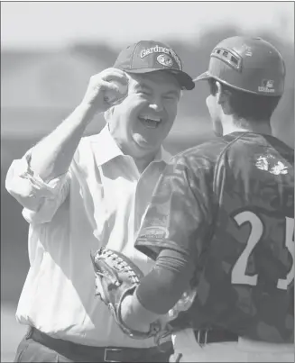  ?? John W. Adkisson, Getty Images ?? Newt Gingrich laughs with Gardner-webb University baseball player Chris Rubessa after throwing out the first pitch in their game against North Carolina A&T State University while campaignin­g Wednesday.