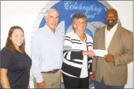  ?? Ken Borsuk / Hearst Connecticu­t Media ?? The Mianus River Boat and Yacht Club presents a check to the Boys &amp; Girls Club of Greenwich to send two kids to the SoundWater­s summer camp. Taking part are, from left, Boys &amp; Girls Club Aquatics Director Jessica Rosa, yacht club commodore Rick Loh, Carol Willson and BGCG CEO Bobby Walker Jr.