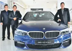  ??  ?? Simon (right), Stephen (left) and Colin proudly introducin­g the gorgeous all new BMW 5 Series.