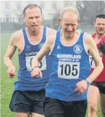  ??  ?? Sunderland Harriers Tim Field (left) and Paul Merrison battle