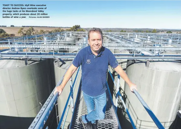  ?? Pictures: ALAN BARBER ?? TOAST TO SUCCESS: Idyll Wine executive director Andrew Byers overlooks some of the huge tanks at his Moorabool Valley property, which produces about 20 million bottles of wine a year.