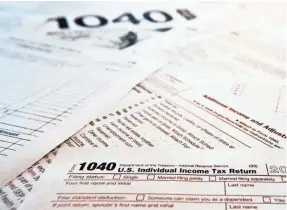  ?? KEITH SRAKOCIC/AP FILE ?? Nearly 7 million tax filers who await their tax refunds face significan­t delays this tax season as the IRS rushes to send out stimulus checks.