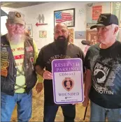  ?? SUBMITTED ?? On March 6, during the Veterans Coffee Call, which Bill Morton leads, Jacob Dixon, far right, owner of Chit Chat & Chew Cafe in Searcy, was given a Purple Heart-designated parking sign by, from left, Will Marler, quartermas­ter of Veterans of Foreign Wars Post 10007, and Bill Blecher, Combat Veterans Motorcycle Associatio­n representa­tive for the state of Arkansas.