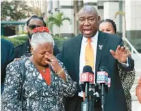  ?? ORLANDO SENTINEL JOE BURBANK/ ?? Civil rights attorney Benjamin Crump addresses media on behalf of his client, retired teacher Linda Stephens, left, during a news conference in front of the Orange County Courthouse in Orlando on Thursday. Crump is suing MidFlorida Credit Union on behalf of Stephens, accusing the credit union of having her arrested for“banking while Black.”