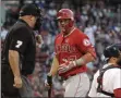  ?? ELISE AMENDOLA - THE ASSOCIATED PRESS ?? Los Angeles Angels’ Mike Trout reacts to home plate umpire Brian O’Nora, who called Trout out on strikes during the first inning of the team’s baseball game against the Boston Red Sox at Fenway Park, Thursday, Aug. 8, 2019, in Boston.