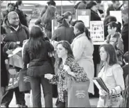  ??  ?? Job seekers attend a health care job fair in New York. A new Associated Press-GfK poll finds that only one in four Americans now expects his or her own financial situation to improve over the next year.