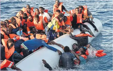  ??  ?? DESPERATE: Migrants in tiny boats are still attempting to make the trip to Europe