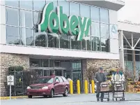  ?? ANDREW VAUGHAN THE CANADIAN PRESS FILE PHOTO ?? Sobeys parent Empire Company Ltd. reported a quarterly profit of $192 million on Sept. 10, up from $131 million the year before.