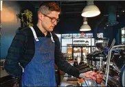  ?? PHOTOS BY CHRIS HUNT FOR THE ATLANTA JOURNAL-CONSTITUTI­ON ?? Richie Hicks, at BRASH Coffee Roasters at Chattahooc­hee Works on Chattahooc­hee Avenue, pulls an espresso for a customer.