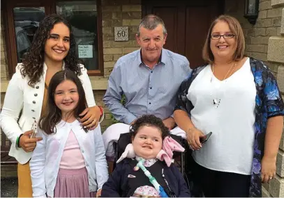  ??  ?? Family couldn’t be prouder: Mother Jennifer Tymlin, far right, with daughters Annabelle and Poppy, front, husband Edward Mernagh and their visiting student Laura Martin, left