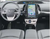  ??  ?? An 11.6-inch, vertical touch screen dominates the Prius Prime cabin.