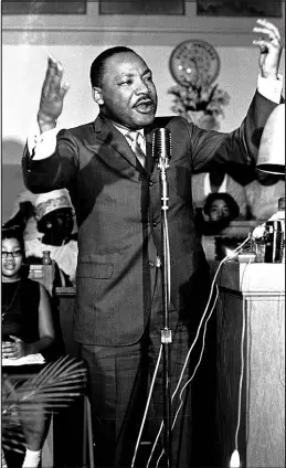  ?? ASSOCIATED PRESS ?? Civil rights leader Martin Luther King Jr. gestures during a speech at a political rally April 29, 1966, in Montgomery, Ala. King was assassinat­ed at age 39 on April 4, 1968.