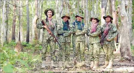  ?? ENVIRONMEN­T MINISTRY ?? Women rangers from the environmen­t ministry pose for photos in a natural protected area.