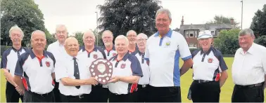  ??  ?? Senior service Prestwick beat Ayr Craigie 5- 3 on the last bowl of the triples to win the Ayr Seniors Top Ten. Associatio­n president Jim Agnew presented the trophy to Prestwick president Archie Patrick as sponsor Gordon Neil looks on