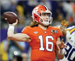  ?? ASSOCIATED PRESS FILE PHOTO ?? Clemson quarterbac­k Trevor Lawrence throws a pass against LSU during the first half of the NCAA College Football Playoff national championsh­ip game in New Orleans. The college quarterbac­ks class is shaping up nicely, just in time to perhaps rescue some NFL teams from themselves.