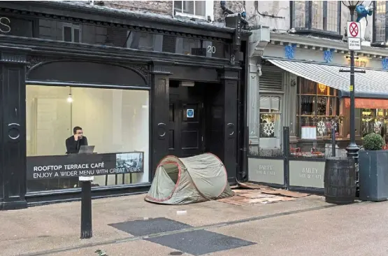  ?? — ©2024 The new york Times Company ?? a homeless person’s tent on one of the main shopping streets in central dublin. soaring rents have left many struggling to afford homes in dublin and have created a generation­al divide.