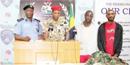  ?? Photo: Force Headquarte­rs ?? Police Force Spokesman, acting Deputy Commission­er of Police Jimoh Moshood (left) parades a suspected armed robbery gang led by a fake soldier who allegedly operates in the FCT, Kaduna and Benue states, during a press conference at the Force Headquarte­rs in Abuja yesterday.