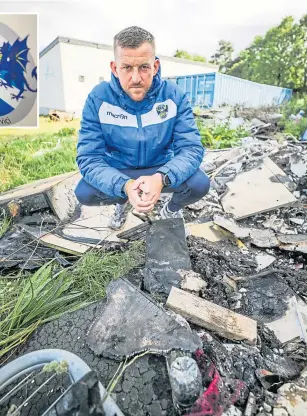  ??  ?? John Cairney with some of the rubbish dumped at Fairfield Park.