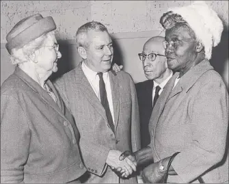  ?? Bob Wilder / Times Union Historic Images ?? Ida Yarbrough, right, greets William P. Mcglone at a meeting of the Capital City Commission in March 1965. At left is Grace Gustafson; John R. Hauf, second from right.