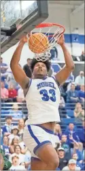  ?? Steven Eckhoff ?? Model’s Jeremias Heard throws down a powerful dunk in the fourth quarter of Wednesday’s state tournament game against Athens Academy.