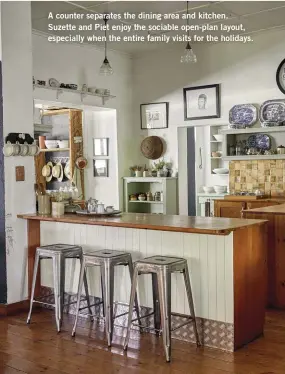  ??  ?? A counter separates the dining area and kitchen. Suzette and Piet enjoy the sociable open-plan layout, especially when the entire family visits for the holidays.